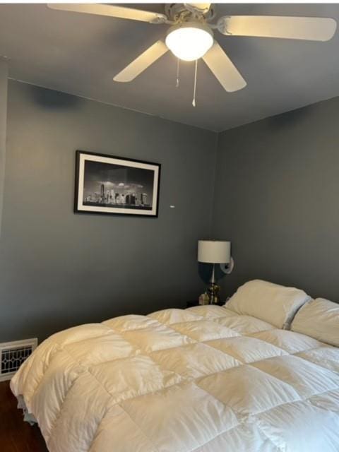 bedroom featuring hardwood / wood-style floors and ceiling fan