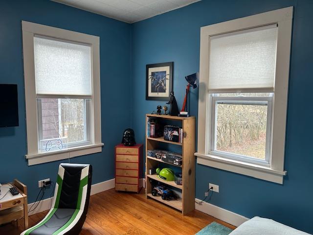 office area with light hardwood / wood-style floors