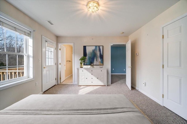 bedroom with light colored carpet