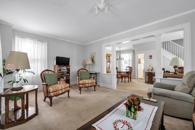 living room with a notable chandelier, light colored carpet, ornamental molding, and ornate columns