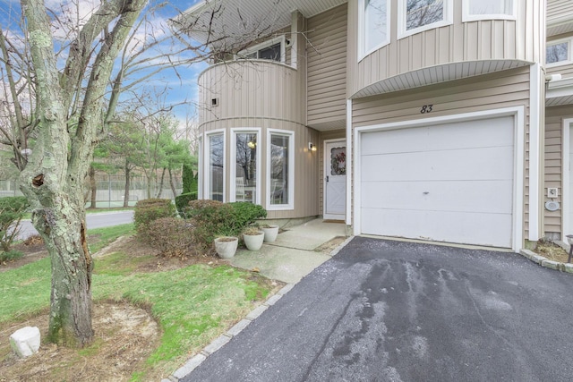 doorway to property featuring a garage