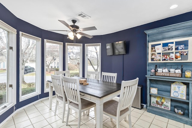 dining area with ceiling fan and light tile patterned floors