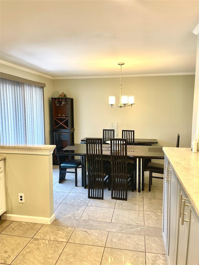 tiled dining room with a notable chandelier and ornamental molding