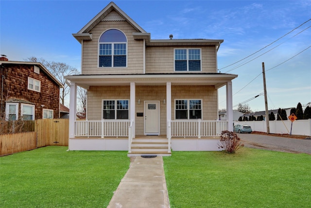 view of front of property with a front lawn and a porch