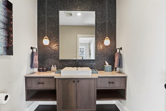 bathroom with vanity and backsplash