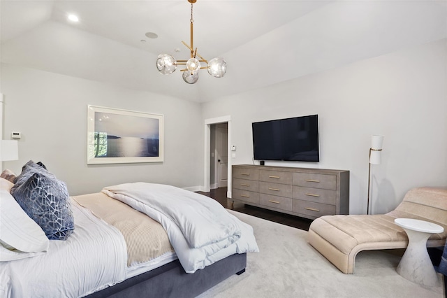 bedroom with an inviting chandelier and hardwood / wood-style floors