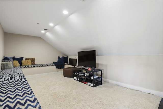 bedroom featuring lofted ceiling and carpet flooring