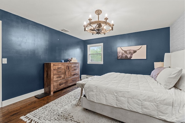 23 Old Brick Rd, New City, NY 10956 - bedroom with a chandelier, wood finished floors, and an accent wall
