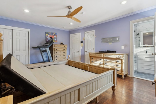 bedroom featuring ceiling fan, dark hardwood / wood-style floors, ornamental molding, and ensuite bathroom