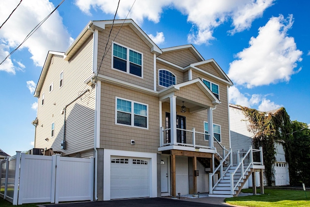 view of front of property featuring a garage and a front yard