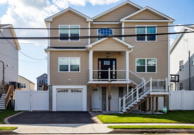 view of front of house featuring a front yard and a garage