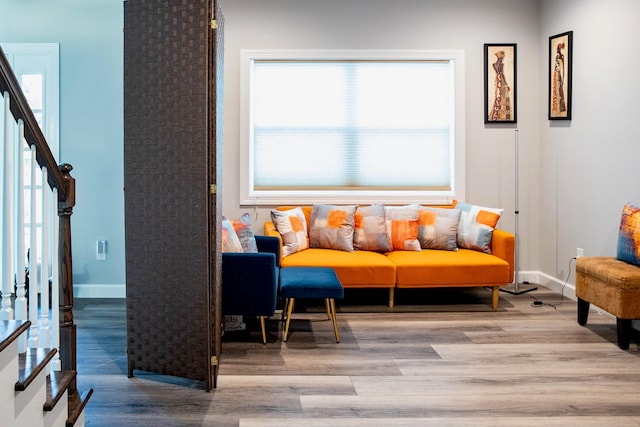 sitting room with a wealth of natural light and light hardwood / wood-style flooring