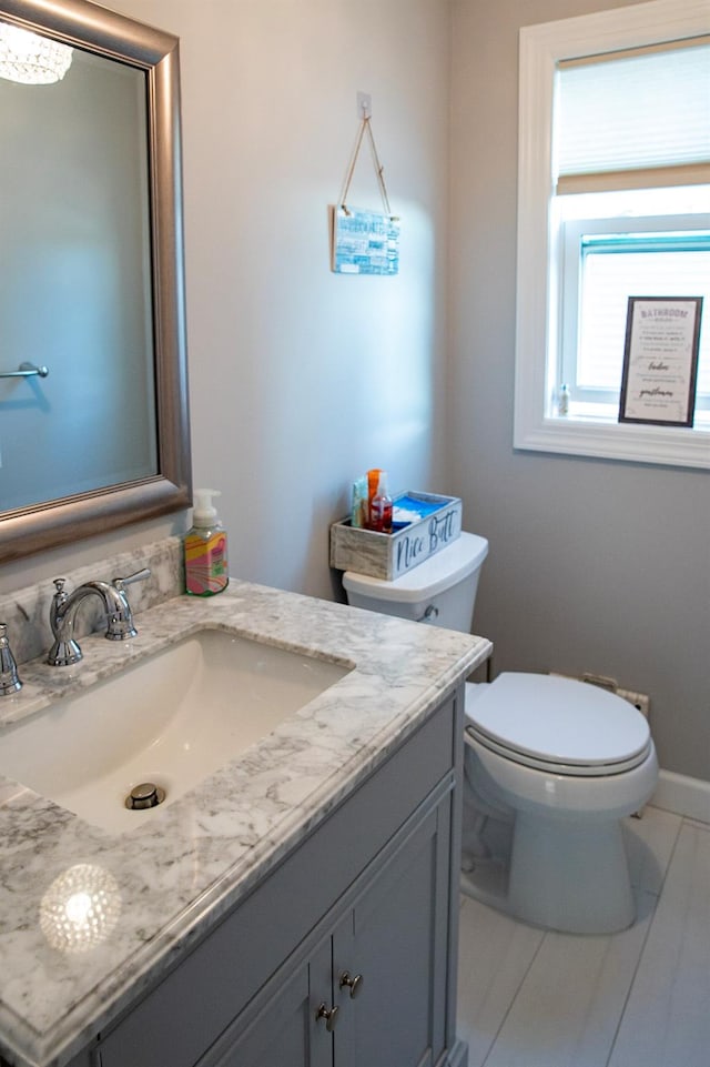 bathroom with vanity and toilet