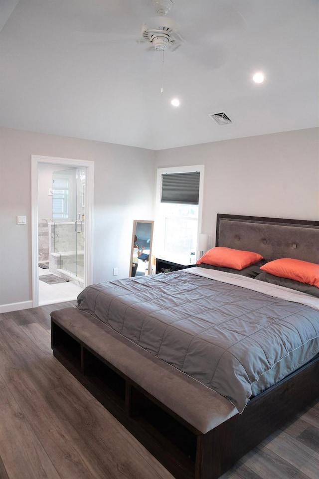 bedroom with connected bathroom, ceiling fan, and dark hardwood / wood-style flooring