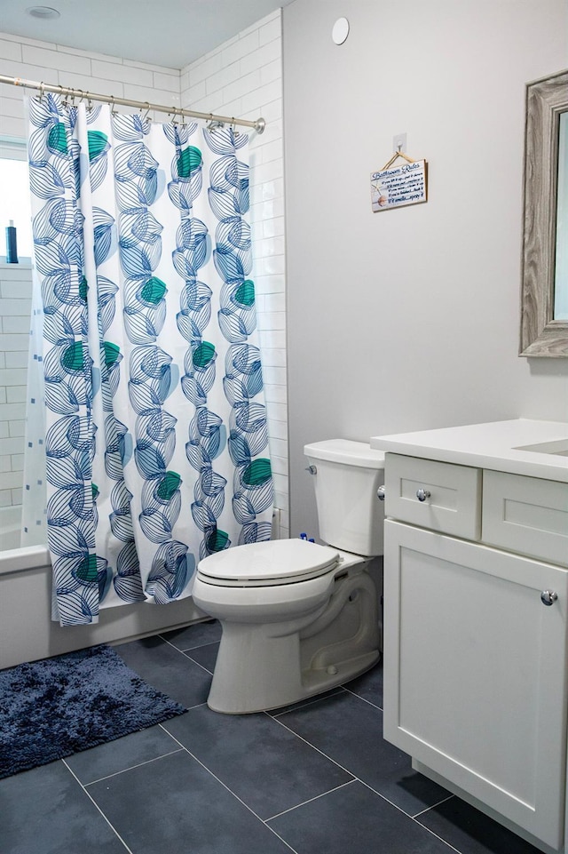 full bathroom with tile patterned floors, vanity, shower / bathtub combination with curtain, and toilet