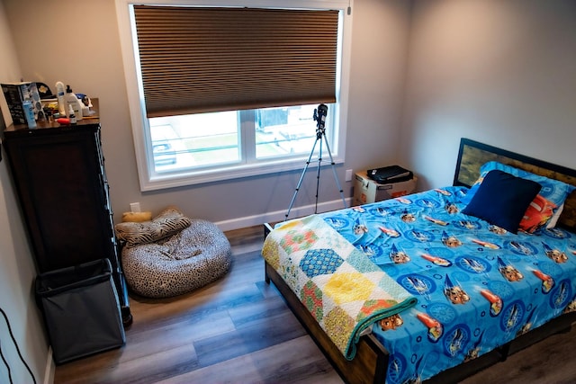 bedroom with hardwood / wood-style floors