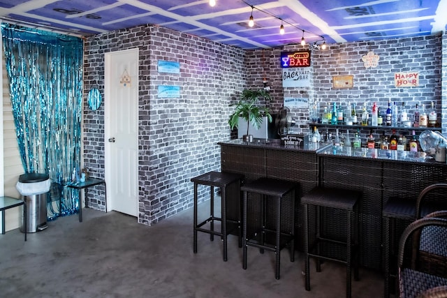 bar featuring concrete floors