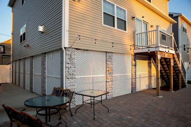 rear view of property featuring a patio