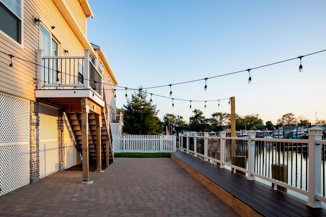 patio terrace at dusk with a water view