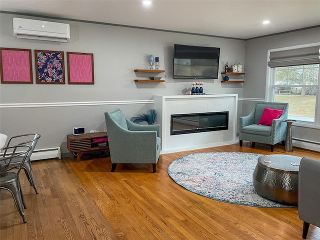 living room featuring an AC wall unit, hardwood / wood-style floors, and baseboard heating