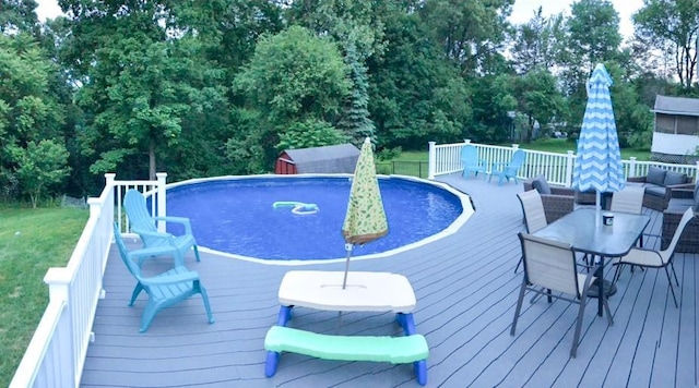 view of swimming pool featuring a wooden deck