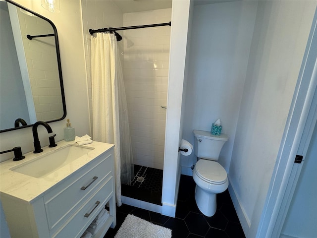 bathroom featuring toilet, vanity, tile patterned flooring, and a shower with shower curtain