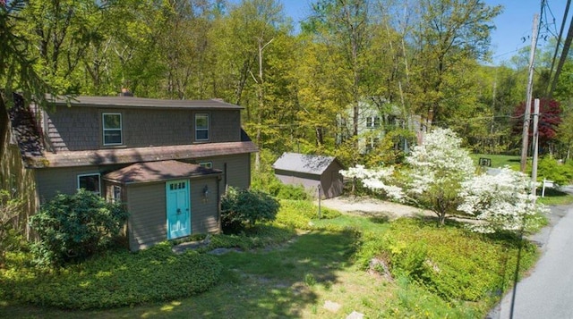 back of property with a shed