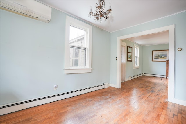 unfurnished dining area with a wall mounted air conditioner, light wood-type flooring, ornamental molding, baseboard heating, and an inviting chandelier