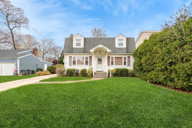 cape cod home with a front yard