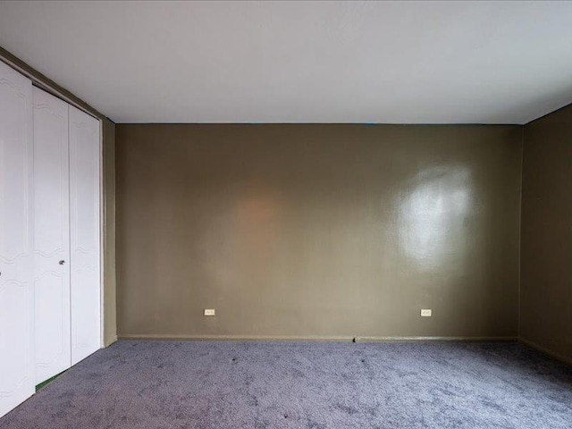 empty room featuring carpet flooring