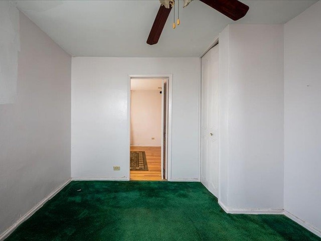 carpeted empty room with ceiling fan