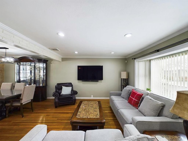 living room with dark hardwood / wood-style flooring and ornamental molding