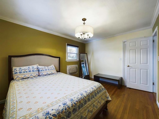 bedroom featuring dark hardwood / wood-style flooring, an inviting chandelier, and ornamental molding