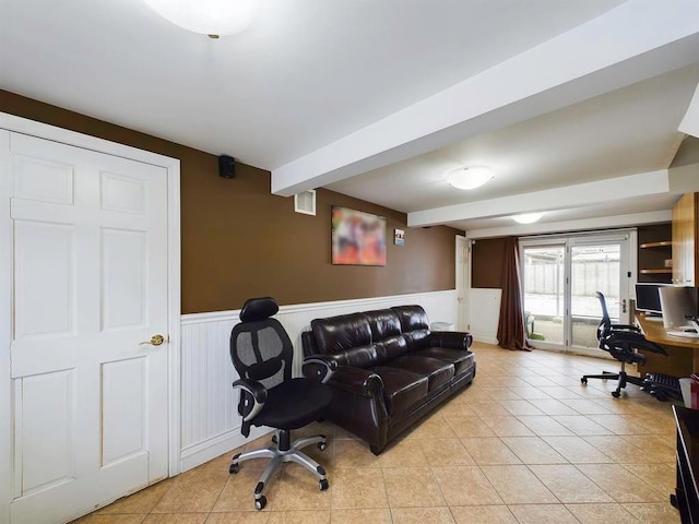 office space featuring beam ceiling and light tile patterned floors