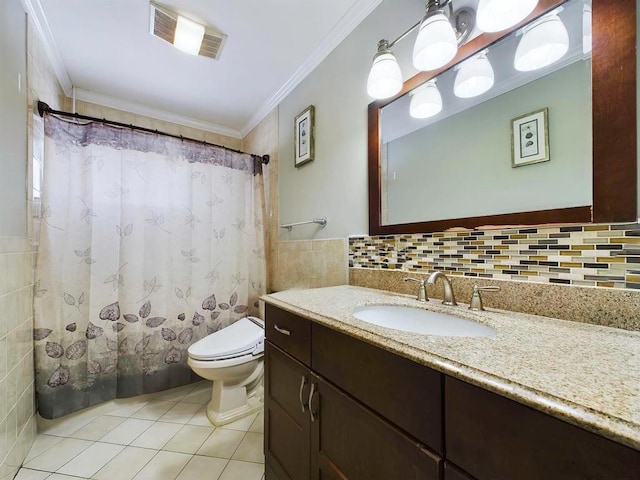 bathroom featuring tile patterned floors, toilet, vanity, and ornamental molding