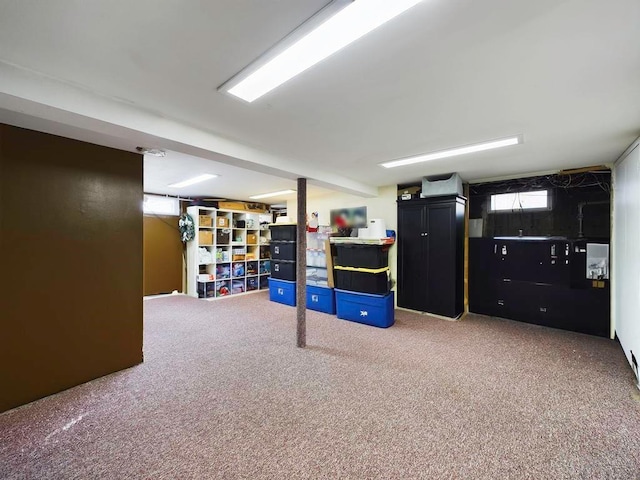 basement with carpet flooring