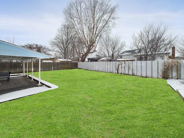 view of yard with a wooden deck