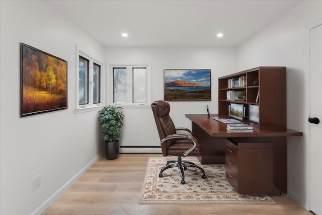 office area featuring light hardwood / wood-style floors and baseboard heating