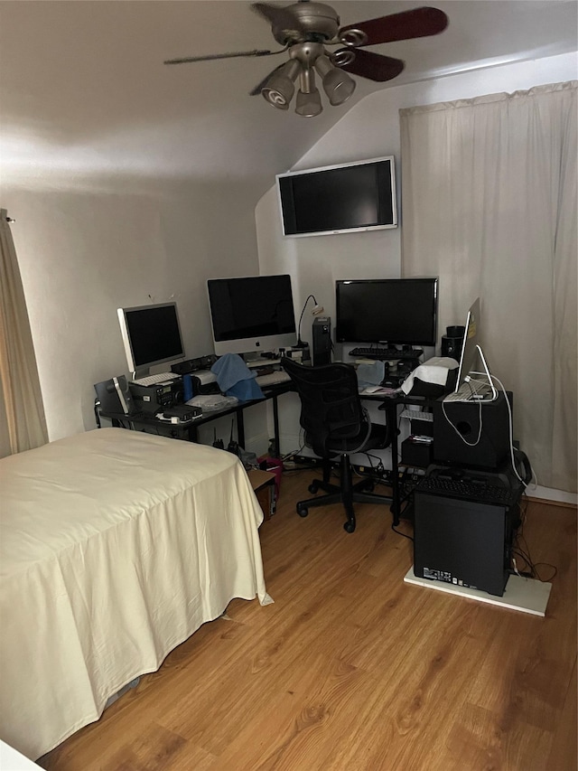 bedroom with hardwood / wood-style floors and ceiling fan