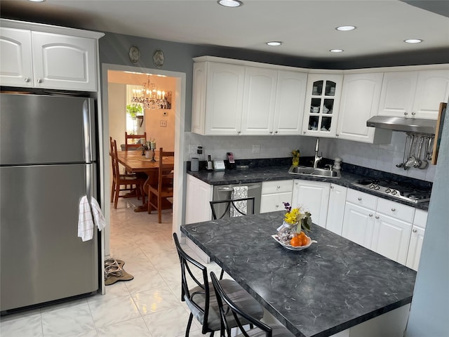 kitchen with white cabinetry, appliances with stainless steel finishes, and sink