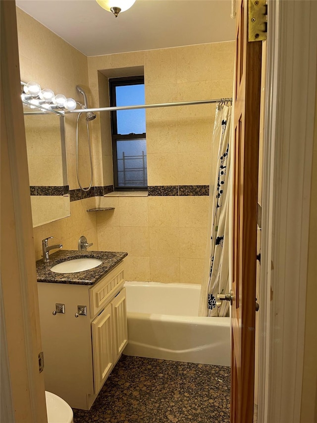 full bathroom featuring vanity, shower / tub combo, and toilet