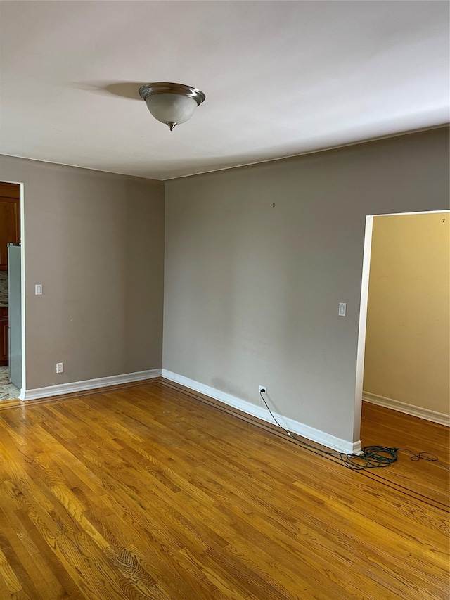 empty room featuring wood-type flooring