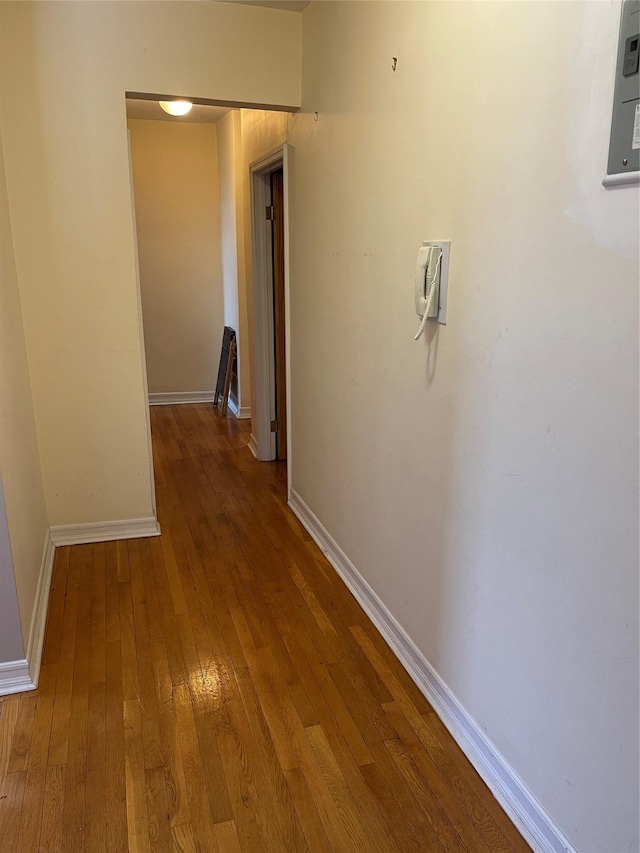 hallway featuring wood-type flooring