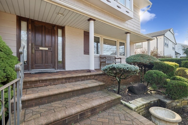 doorway to property featuring covered porch