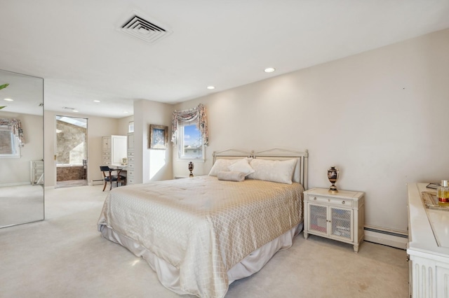 carpeted bedroom with multiple windows and a baseboard heating unit