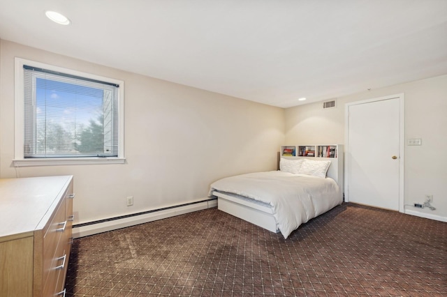 bedroom featuring a baseboard heating unit