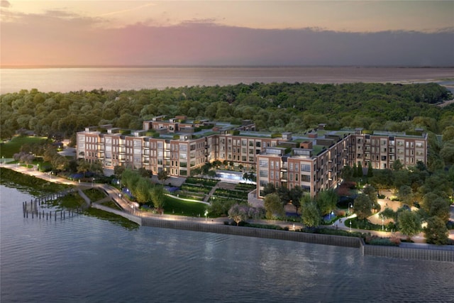 aerial view at dusk with a water view