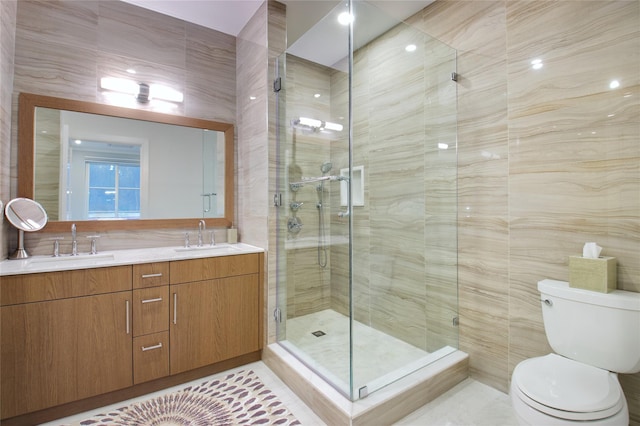 bathroom with vanity, toilet, walk in shower, and tile walls