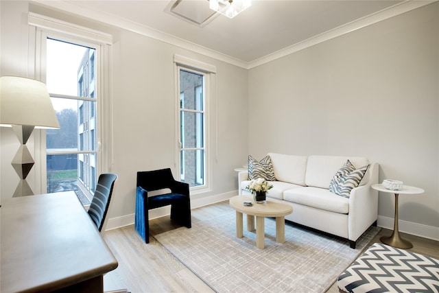 living room featuring light wood-type flooring and ornamental molding