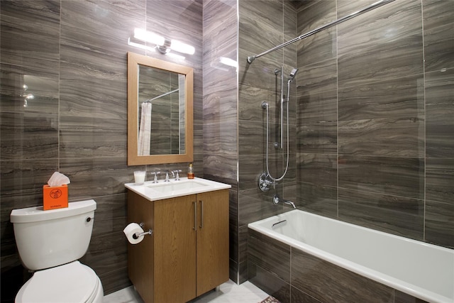 full bathroom with shower / tub combo with curtain, vanity, tile walls, and toilet